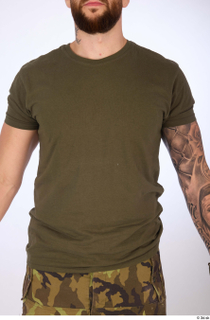 Danas dressed olive green crew-neck t-shirt upper body 0001.jpg